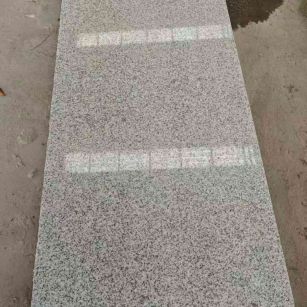 陇南芝麻白光面毛板